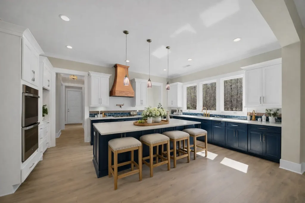 Kitchen with blue cabinetry, a large island and wood flooring